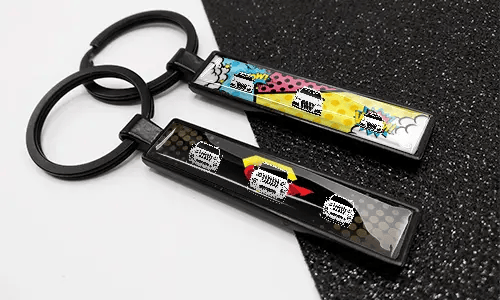 Comic-style license plate keychains featuring colorful designs and car illustrations