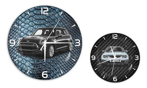 Two wall clocks with car illustrations: left with black car on blue reptile texture, right with blue car on carbon background