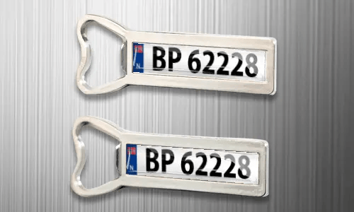 two magnet bottle openers on the fridge