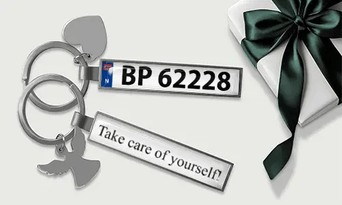 Metal license plate keychain with heart and angel wing charms