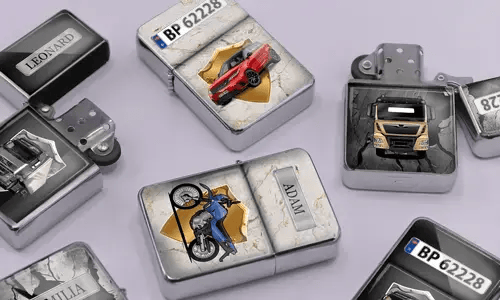 A variety of metal lighters lie on a soft purple surface, featuring personalized designs of cars, motorcycles, and trucks, each marked with different names.