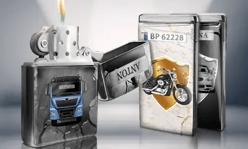 Open metal lighter with a blue truck design, flame lit. Behind are two closed lighters with images: a motorcycle and a car with license plates.