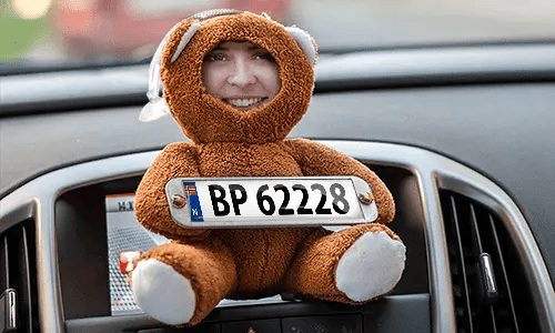 Cuddly toy with photo in the car Cuddly toy with photo in the car