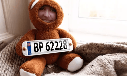 Cuddly toy with photo in the house