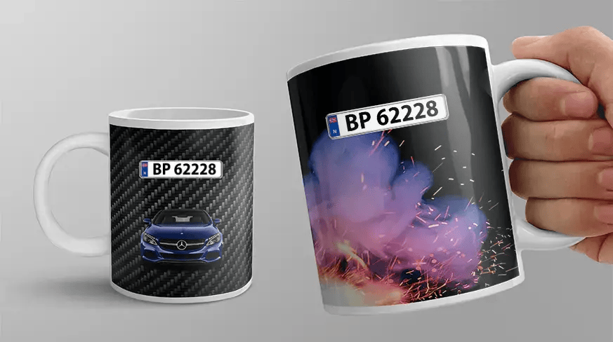 Two white mugs with car-themed designs: blue Mercedes on carbon background, silver BMW with sparks and smoke